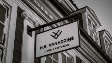 H.e. vanadzins restaurant sign on building.