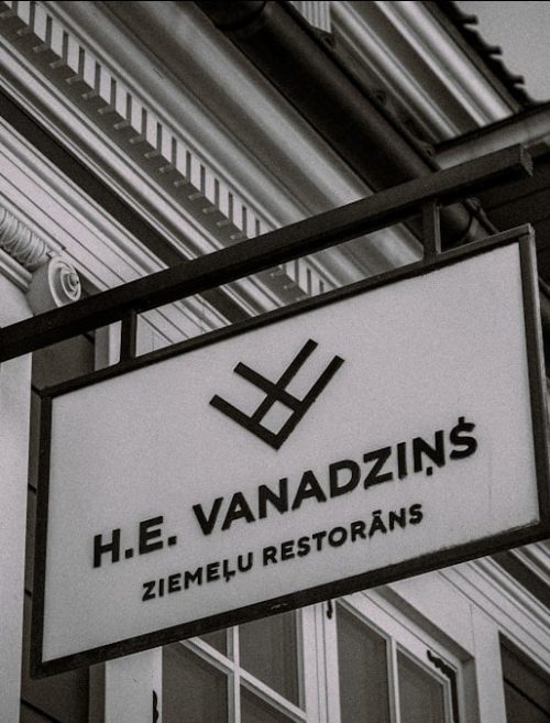 H.e. vanadzins restaurant sign on building.
